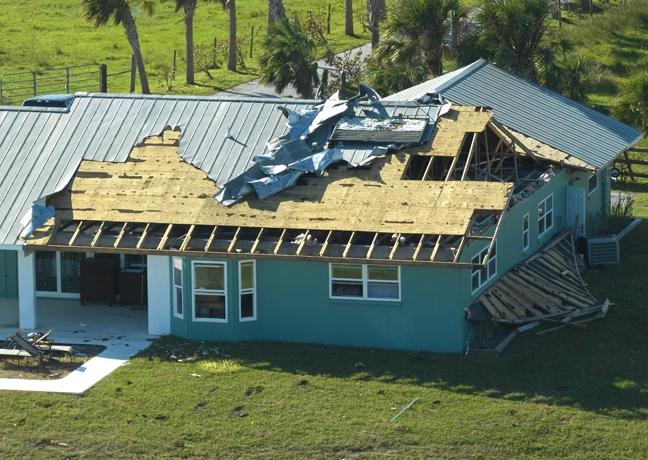 Wind damaged metal roof